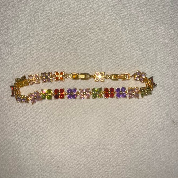 Gold bracelet with multi colored flower charms - Picture 1 of 1